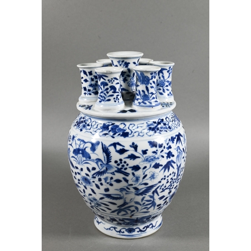 435 - A 19th century Chinese blue and white tulip vase (tulipiere) with seven spouts, painted in tones of ... 