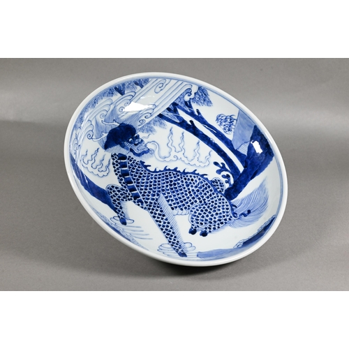 445 - A Chinese transitional style blue and white charger in the mid 17th century manner, painted in rich ... 