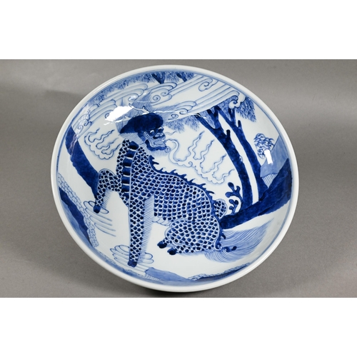 445 - A Chinese transitional style blue and white charger in the mid 17th century manner, painted in rich ... 