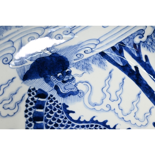 445 - A Chinese transitional style blue and white charger in the mid 17th century manner, painted in rich ... 