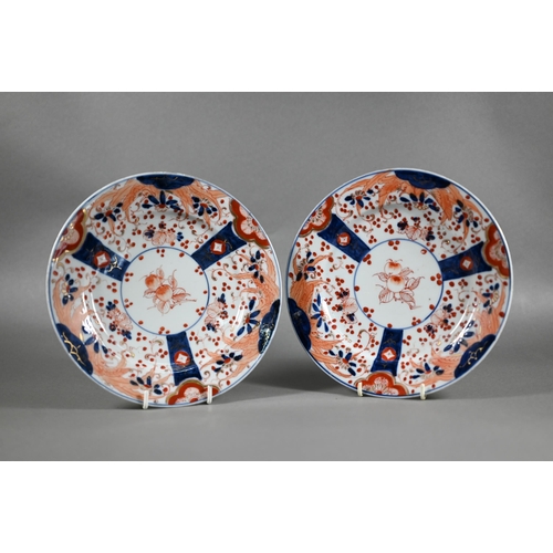 455 - A pair of 18th century Chinese Imari phoenix and peach pattern plates, painted in the typical palett... 