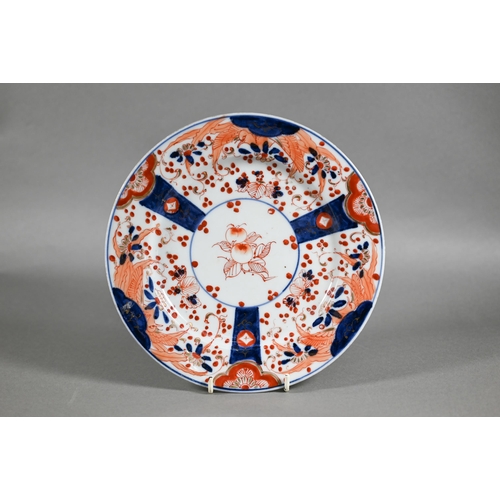 455 - A pair of 18th century Chinese Imari phoenix and peach pattern plates, painted in the typical palett... 