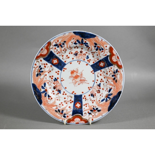 455 - A pair of 18th century Chinese Imari phoenix and peach pattern plates, painted in the typical palett... 