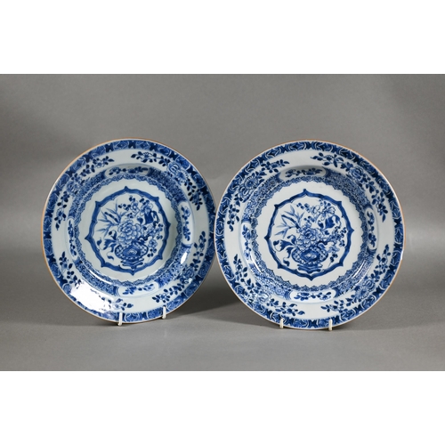 456 - A pair of 18th century Chinese blue and white plates painted with floral design in tones of undergla... 