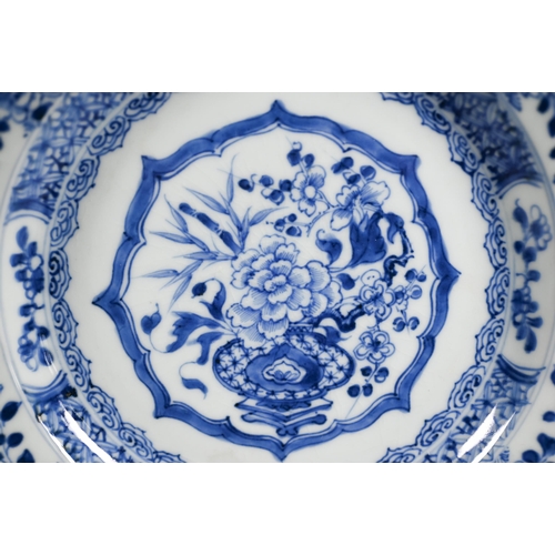 456 - A pair of 18th century Chinese blue and white plates painted with floral design in tones of undergla... 