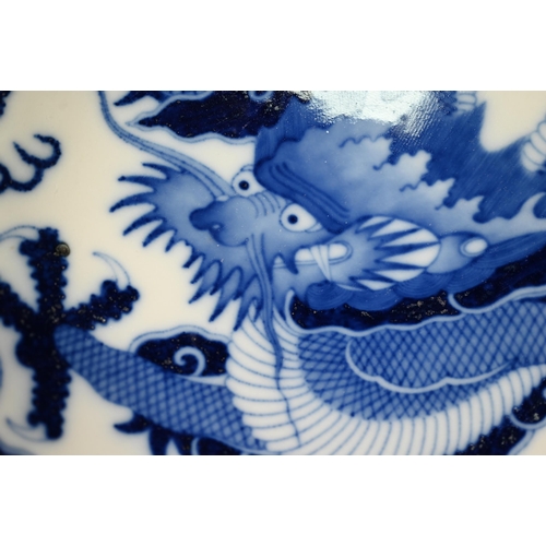 457 - A Chinese transitional style blue and white dragon charger in the mid 17th century manner, painted i... 