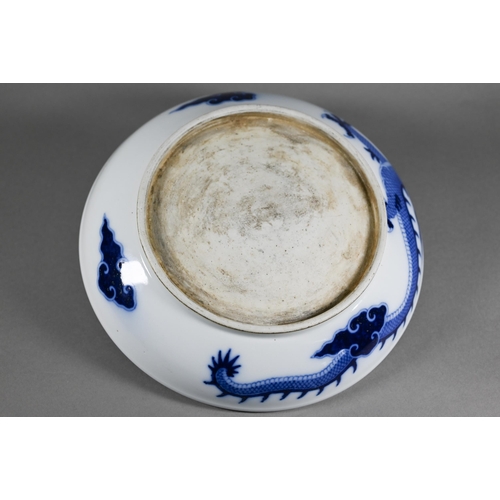 457 - A Chinese transitional style blue and white dragon charger in the mid 17th century manner, painted i... 