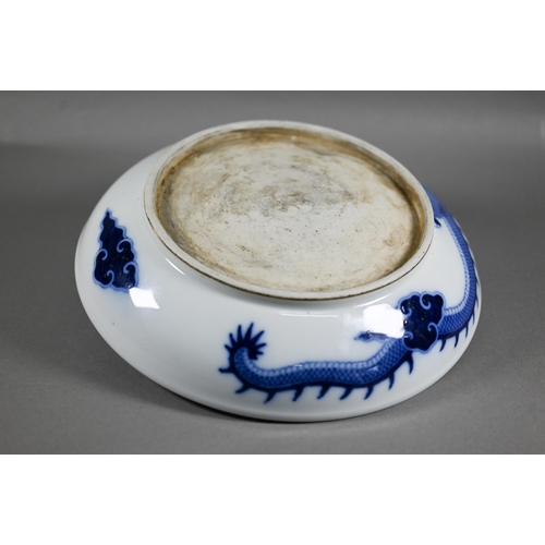 457 - A Chinese transitional style blue and white dragon charger in the mid 17th century manner, painted i... 