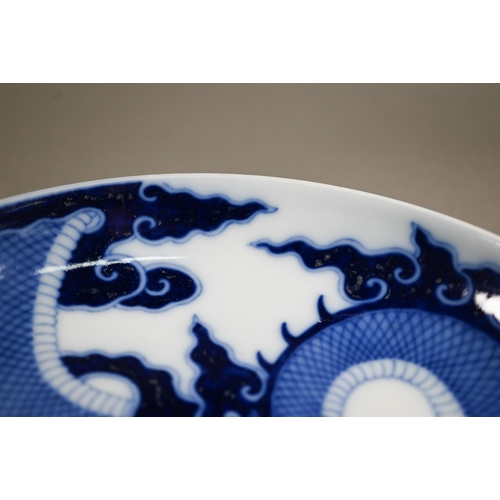 457 - A Chinese transitional style blue and white dragon charger in the mid 17th century manner, painted i... 