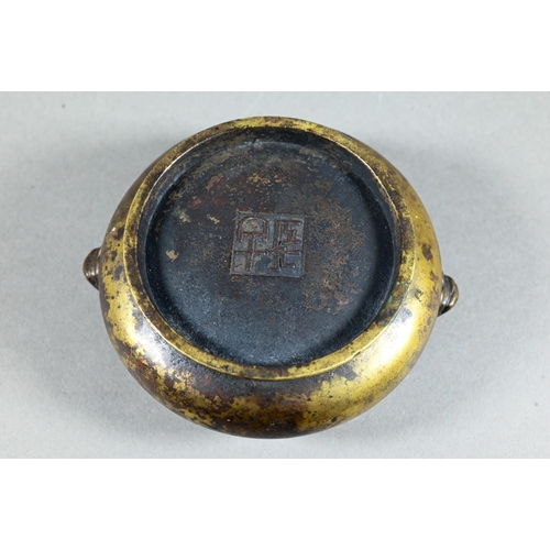 459 - An 18th/19th century Chinese gilt bronze censer or compressed globular form on circular foot cast wi... 