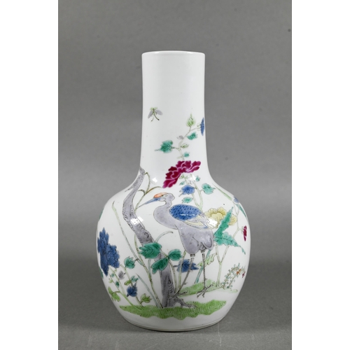 462 - A 19th century Chinese famille rose bottle vase, painted in polychrome enamels with a tall prunus tr... 