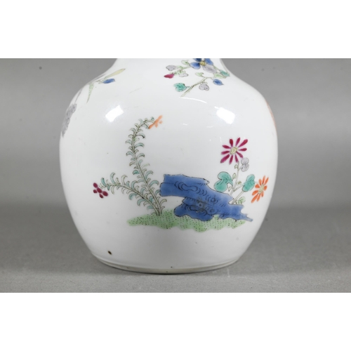 462 - A 19th century Chinese famille rose bottle vase, painted in polychrome enamels with a tall prunus tr... 