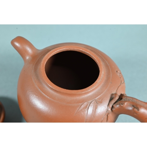 466 - A vintage Chinese Yixing teapot and cover with relief moulded prunus decoration, circa 1970, seal ma... 