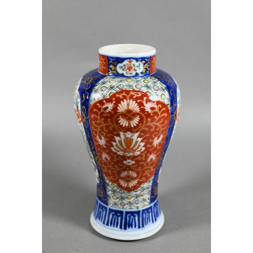 467 - A 19th century Japanese Imari baluster vase, painted in polychrome enamels with landscapes, mythical... 