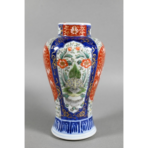 467 - A 19th century Japanese Imari baluster vase, painted in polychrome enamels with landscapes, mythical... 