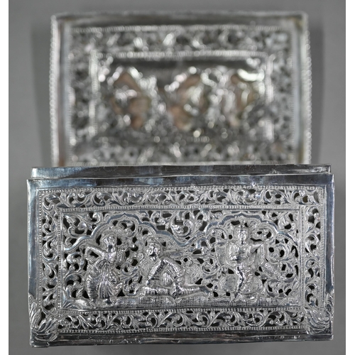 47 - A late 19th/early 20th century Burmese pierced silver (unmarked) box with hinged cover, richly embos... 