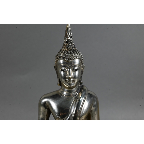 471 - A 20th century silvered base-metal Thai figure of Shakyamuni Buddha with hands in the meditation pos... 