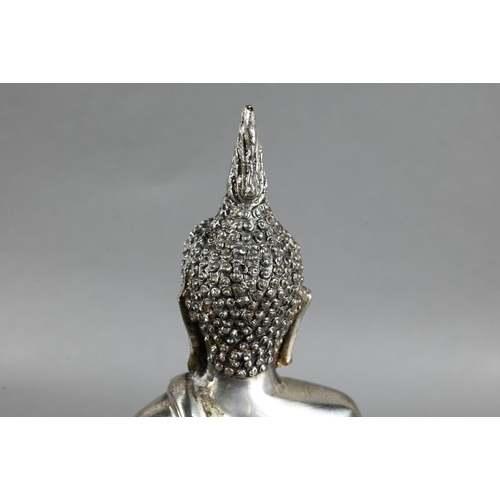 471 - A 20th century silvered base-metal Thai figure of Shakyamuni Buddha with hands in the meditation pos... 