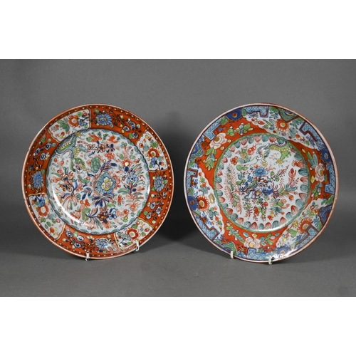 475 - Two 18th century Chinese blue and white polychrome clobbered plates, painted with dragons and floral... 