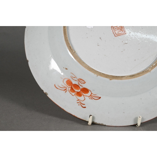 475 - Two 18th century Chinese blue and white polychrome clobbered plates, painted with dragons and floral... 