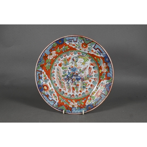 475 - Two 18th century Chinese blue and white polychrome clobbered plates, painted with dragons and floral... 