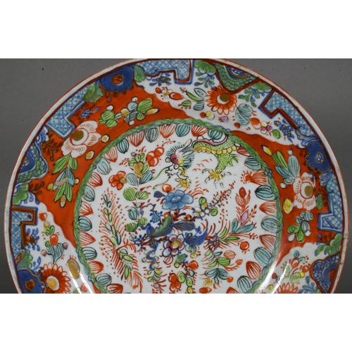 475 - Two 18th century Chinese blue and white polychrome clobbered plates, painted with dragons and floral... 