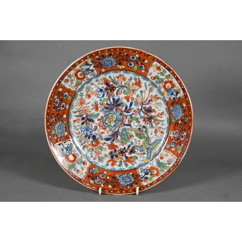 475 - Two 18th century Chinese blue and white polychrome clobbered plates, painted with dragons and floral... 