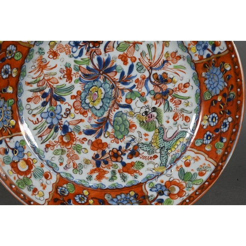 475 - Two 18th century Chinese blue and white polychrome clobbered plates, painted with dragons and floral... 