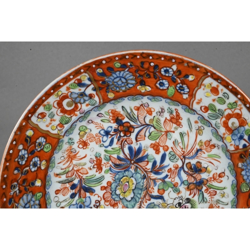 475 - Two 18th century Chinese blue and white polychrome clobbered plates, painted with dragons and floral... 