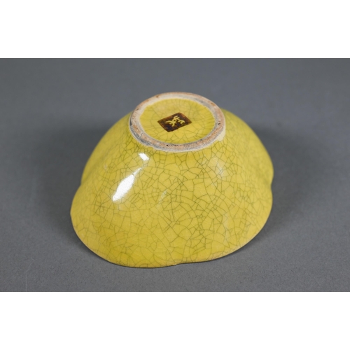 476 - A 20th century Chinese Ge style yellow quatrafoil bowl evenly covered with a finely crackled lemon y... 