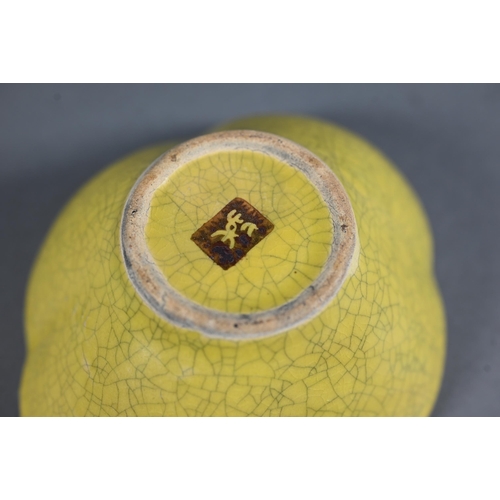 476 - A 20th century Chinese Ge style yellow quatrafoil bowl evenly covered with a finely crackled lemon y... 