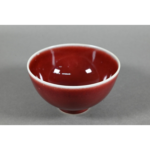 477 - A Chinese Lang Yao/sang-de-boeuf bowl, covered with a rich copper red glaze, contrasting white rim a... 