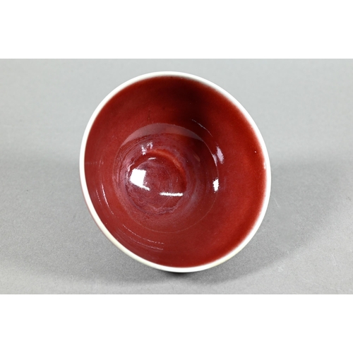 477 - A Chinese Lang Yao/sang-de-boeuf bowl, covered with a rich copper red glaze, contrasting white rim a... 