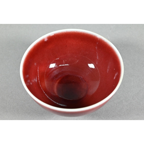 477 - A Chinese Lang Yao/sang-de-boeuf bowl, covered with a rich copper red glaze, contrasting white rim a... 