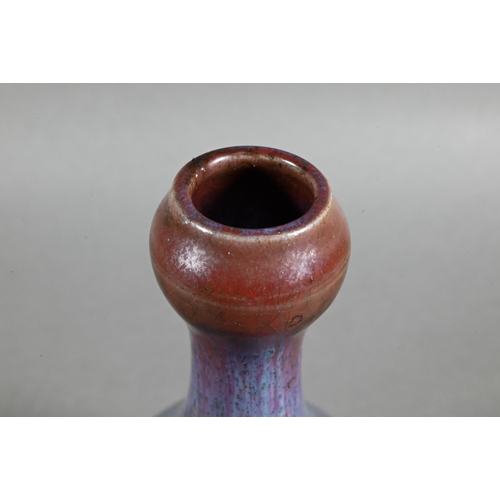 487 - A Chinese Jun style yao bian (transmutation glaze) garlic head vase with buff speckled streaky purpl... 