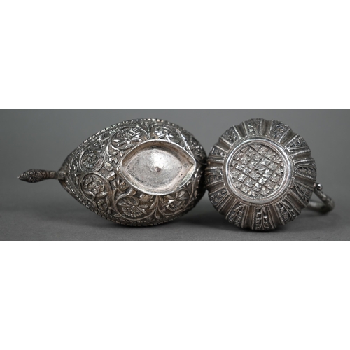 49 - An Indian low-grade silver small cream and sugar pair with cobras' heads handles and foliate chased ... 
