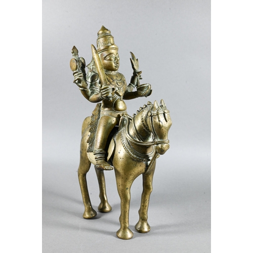 492 - An Indian brass figure of Khandoba (manifestation of Shiva) on the back of his horse, the four-armed... 