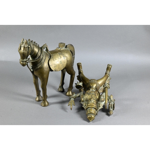 492 - An Indian brass figure of Khandoba (manifestation of Shiva) on the back of his horse, the four-armed... 