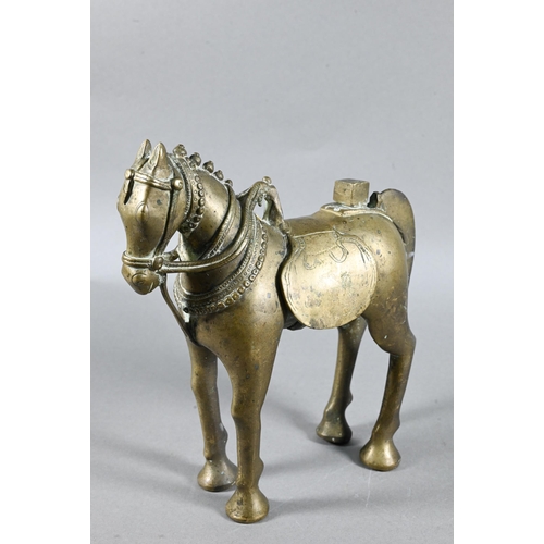 492 - An Indian brass figure of Khandoba (manifestation of Shiva) on the back of his horse, the four-armed... 