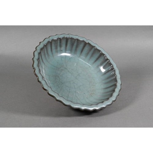 493 - A Chinese scalloped dish in the Ru ware manner covered overall with a blue/green crackled glaze, 19 ... 