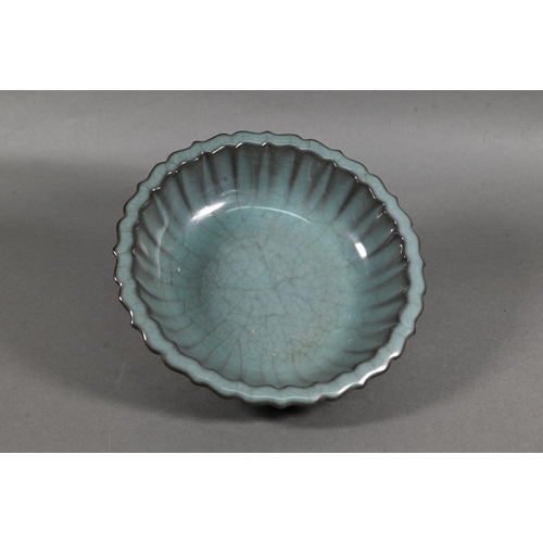 493 - A Chinese scalloped dish in the Ru ware manner covered overall with a blue/green crackled glaze, 19 ... 