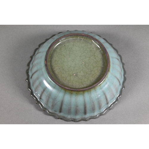 493 - A Chinese scalloped dish in the Ru ware manner covered overall with a blue/green crackled glaze, 19 ... 