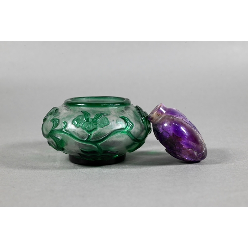 494 - A 19th century Chinese amethyst snuff bottle carved on one side with Shoulou under a tall pine tree,... 