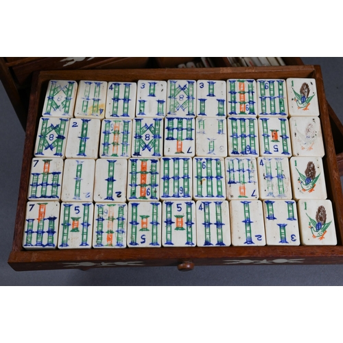 499 - A Chinese Mah Jong set, the hardwood and bone inlaid case with two carry handles and sliding front p... 