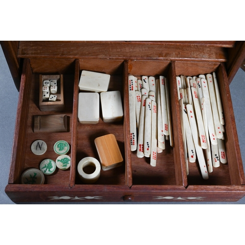 499 - A Chinese Mah Jong set, the hardwood and bone inlaid case with two carry handles and sliding front p... 