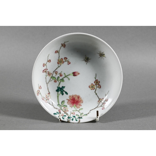 513 - A Chinese famille rose dish painted in polychrome enamels with two insects, blossoming peony and pru... 