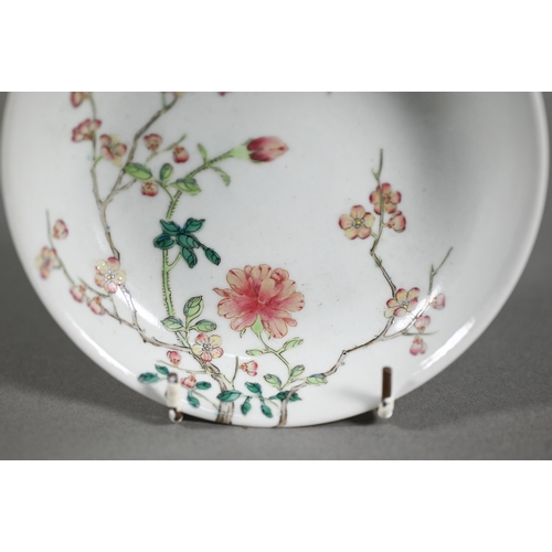 513 - A Chinese famille rose dish painted in polychrome enamels with two insects, blossoming peony and pru... 