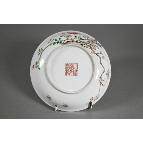 513 - A Chinese famille rose dish painted in polychrome enamels with two insects, blossoming peony and pru... 