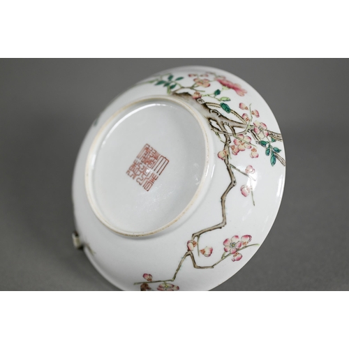 513 - A Chinese famille rose dish painted in polychrome enamels with two insects, blossoming peony and pru... 