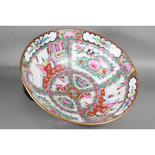 514 - A 20th century Chinese famille rose punch bowl painted with figures, flowers and birds in alternatin... 